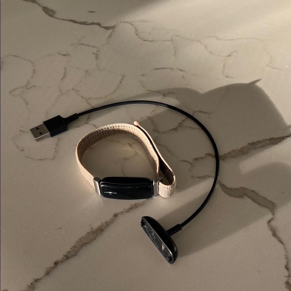 Fitbit Tracker with Tan Strap and Black Display